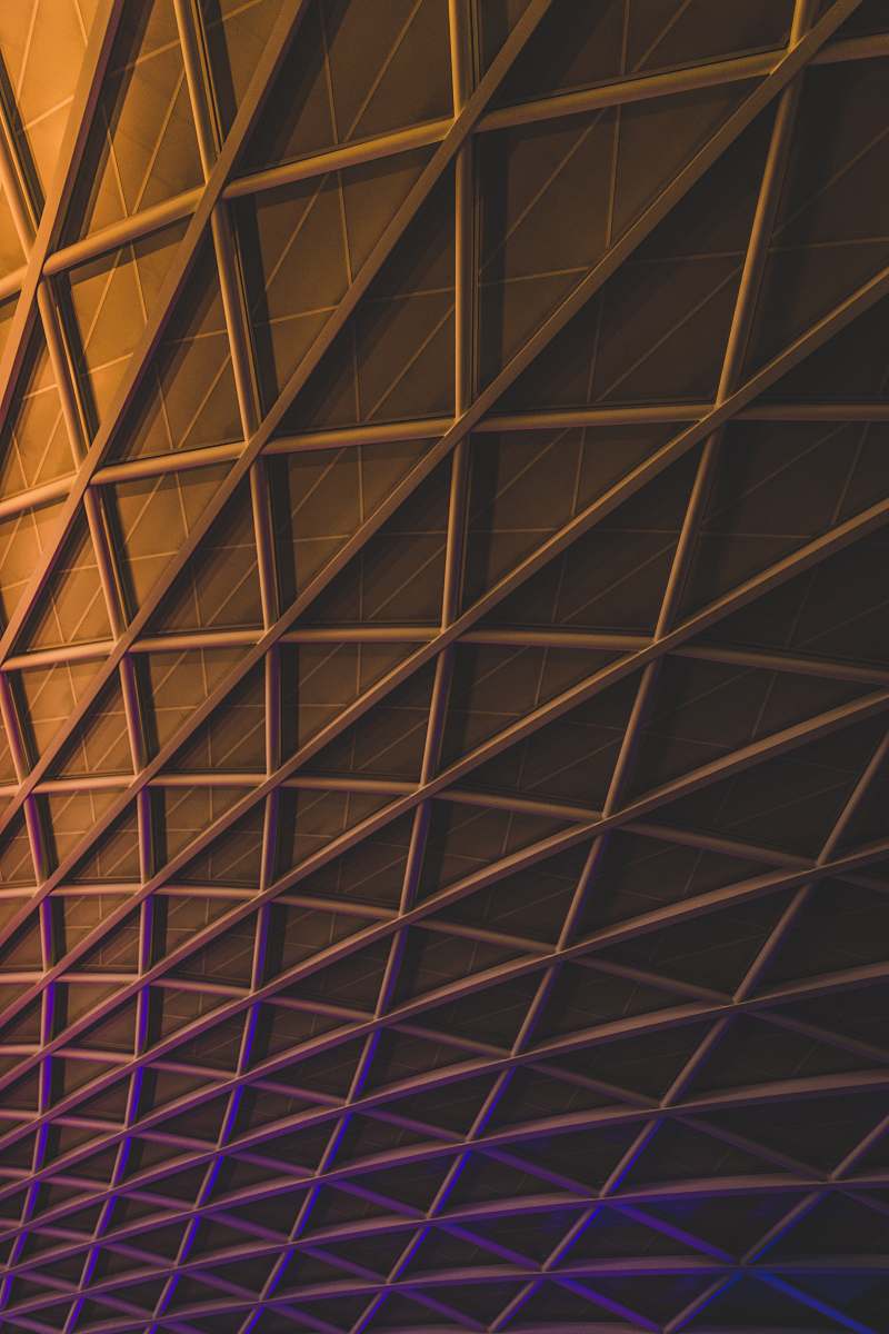 iphone backgrounds A meshwork of steel beams on an illuminated facade iphone wallpapers